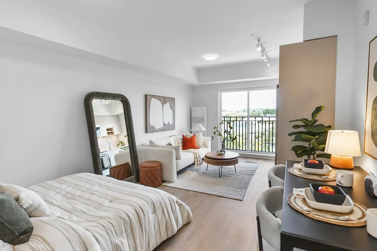 Staged suite with bedroom and living area